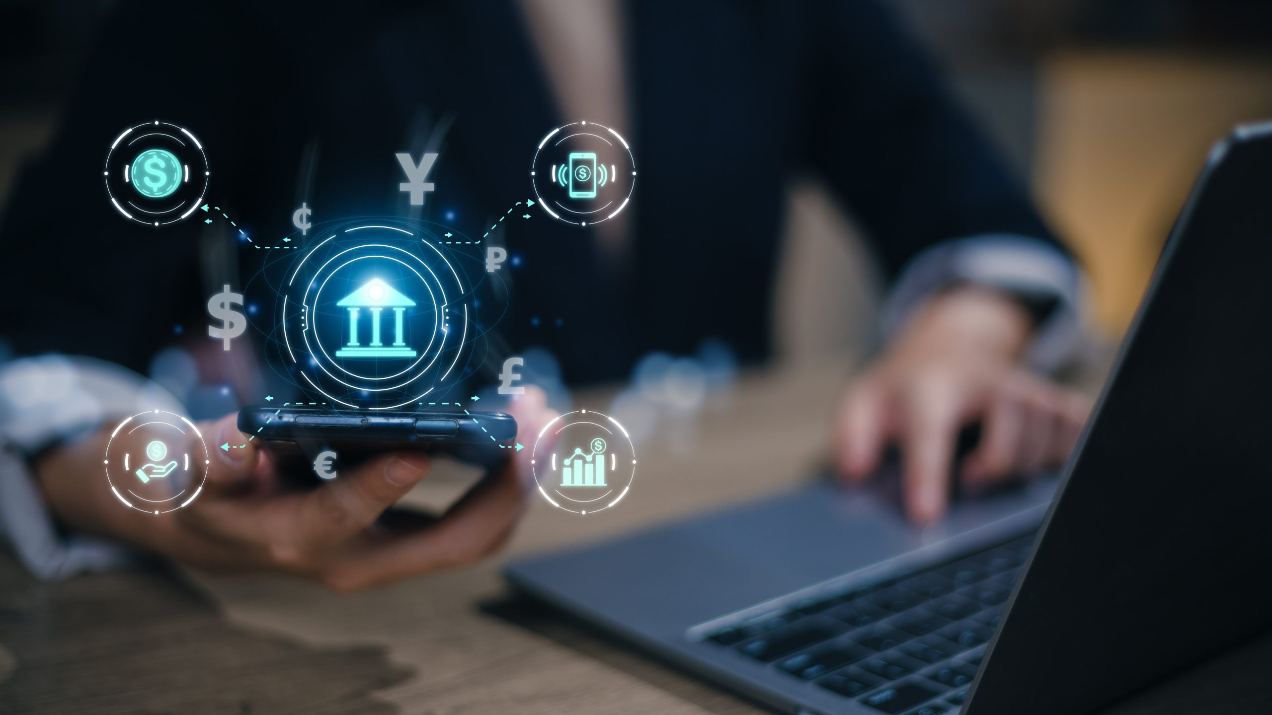 Fintech financial technology on smartphone concept. Hand with smartphone and text fintech and financial icons on the futuristic virtual interface screen.